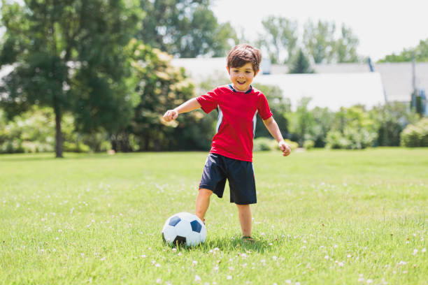 istock Young soccer player having fun on a field with ball 1560531658