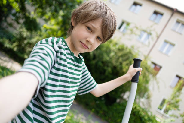 Teenage boy taking a selfie outdoor gym.