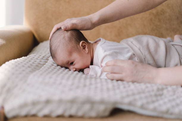 istock Baby learns to hold its head and roll over on my stomach. 1560535310