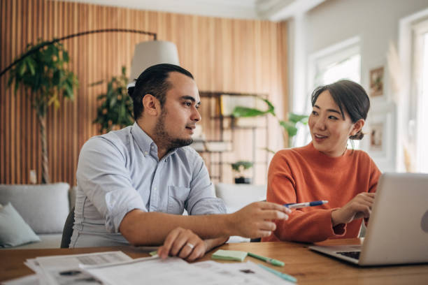 istock Man and woman working in home office 1560556242