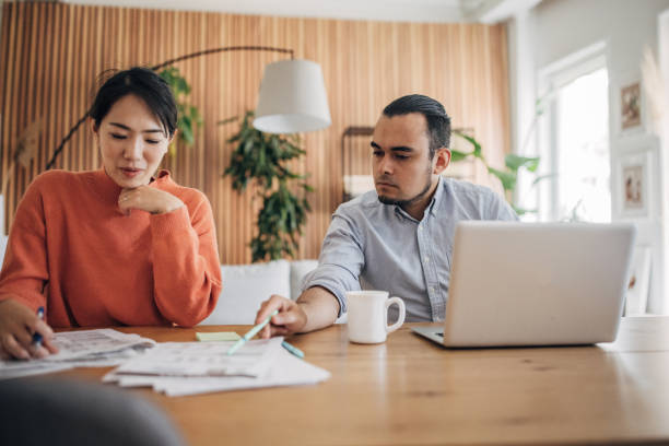 istock Man and woman working in home office 1560568001
