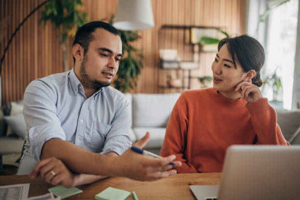 istock Man and woman working in home office 1560570193