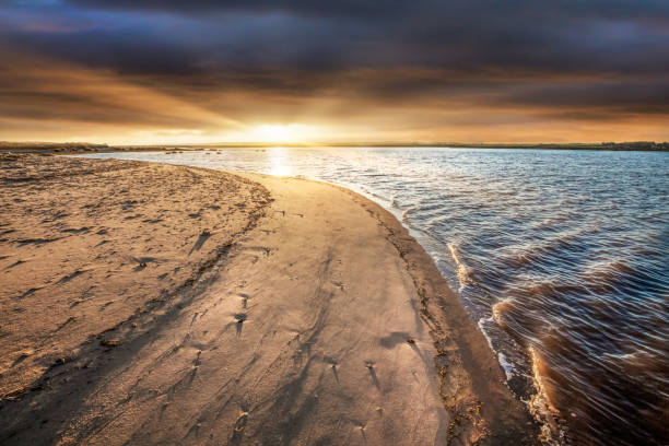 Beach sunrise at Burnham Overy Staithe in Norfolk England