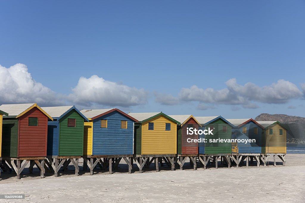 Beach at Muizenberg South Africa with colorful huts The Victorian beach houses is a landmark for Muizenberg False Bay Africa Stock Photo