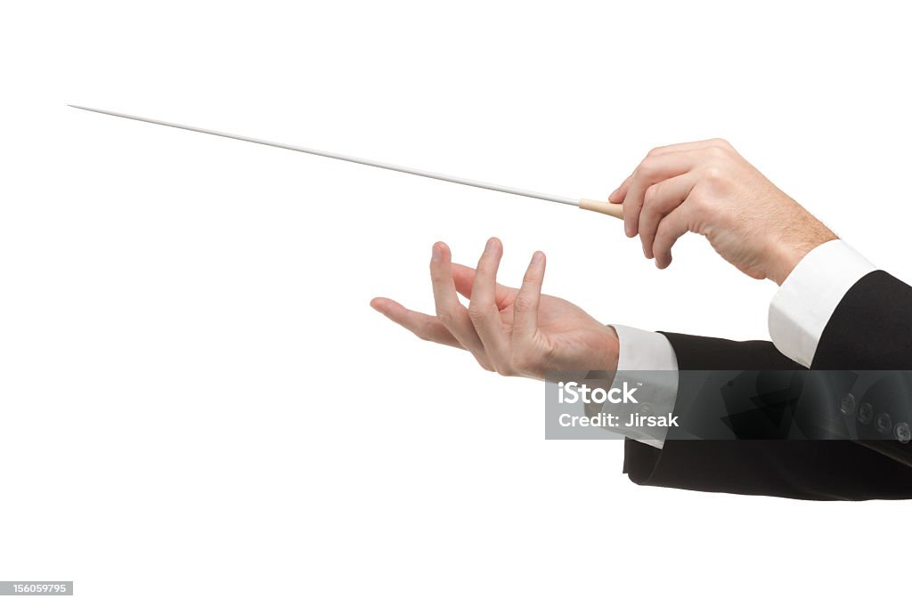 Conductors hands with pointy stick isolated on white Male orchestra conductor hands, one with baton. White background. Musical Conductor Stock Photo