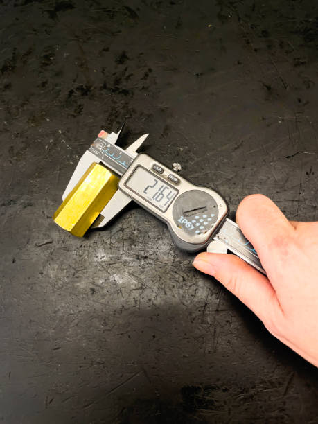istock Hand of a person using a caliper gauge 1560607906