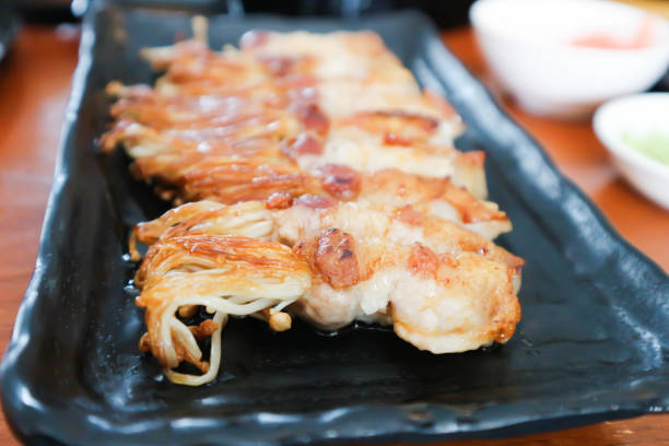 istock bacon wrapped hinoki, bacon wrapped mushroom or grilled bacon 1560628603