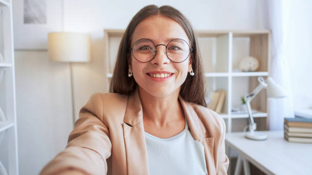 istock Taking selfie digital self-portrait woman smiling 1560630842
