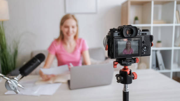 istock Camera recording digital media woman screen tripod 1560630846