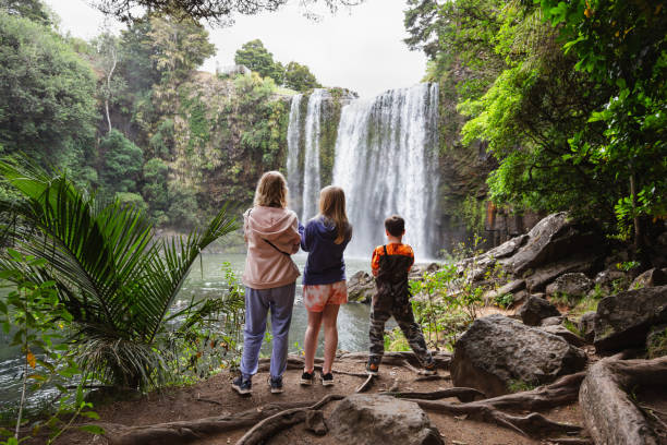 istock Mum and Two children looking at Waterfall 1560631385