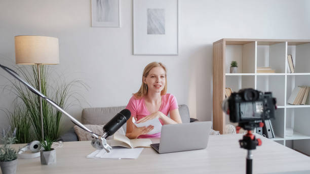 istock Coaching blog content recording woman camera 1560632563