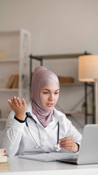 istock Online doctor video connection woman conference 1560633078