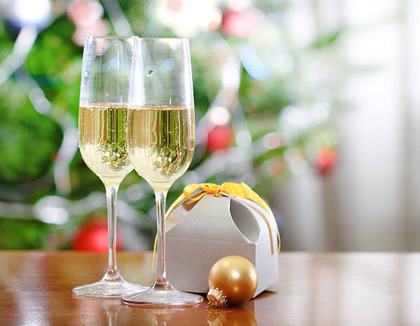 istock Glasses of champagne and Christmas present 156063834