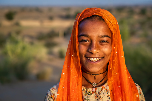 Happy Gypsy Indian girl from desert village, Thar Desert, Rajasthan, India.