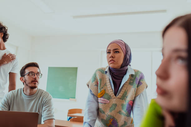 istock A diverse group of students gathers in a modern school classroom, passionately engaging in lively discussions about various projects, embracing teamwork and utilizing technology to enhance their learning experience 1560651732