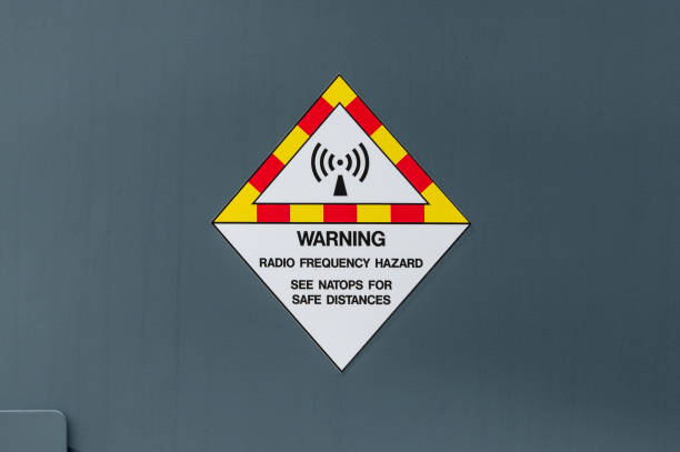 Warning sign stating that there is a possibility of a radio frequency hazard and that personnel should keep a safe distance