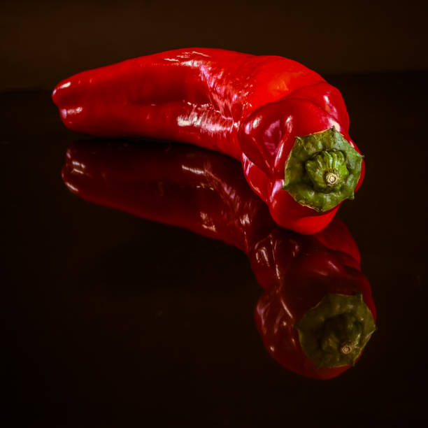 istock The side reflection of a giant red pepper. 1560662940