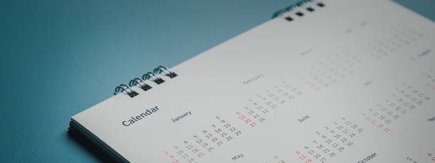istock Embroidered red pins on a calendar event Planner calendar,clock to set timetable organize schedule,planning for business meeting or travel planning concept. 1560667872