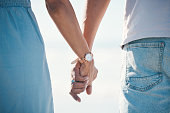 Couple, holding hands and love outdoor with trust, comfort and hope, empathy and kindness. Together, support and man with woman for family, solidarity and bond, loyalty and marriage commitment