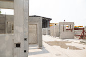 Prefabricated concrete walls for building office buildings and residential houses. Precast reinforced concrete wall panel for construction building.