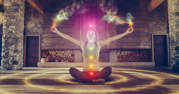 istock Beautiful Relaxed Caucasian Woman Meditating In Zenlike Openair Space. Edited Visualization Of Multi Colored Chakras Glowing On Her Body. Spirituality, Yoga, Self-care, Mindfulness Concept. 1560695702