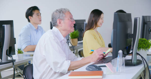 istock teacher in adult education class 1560719719