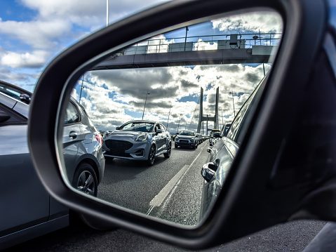 Traffic jam seen in a car's side mirror