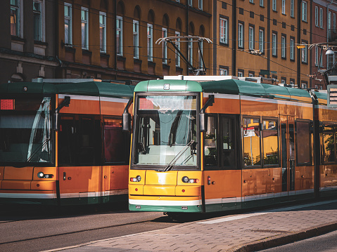 two trams in the city during day