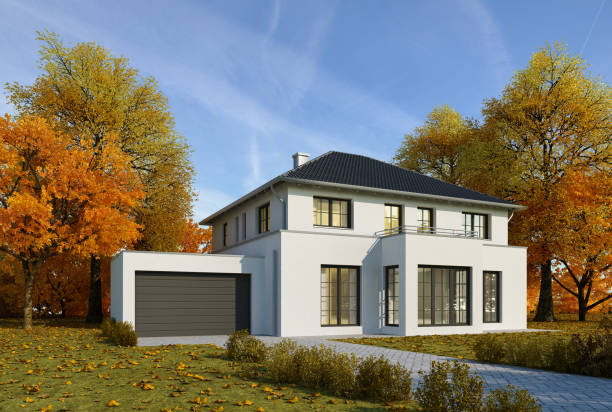 istock Modern white house with garage in autumn 1560745209