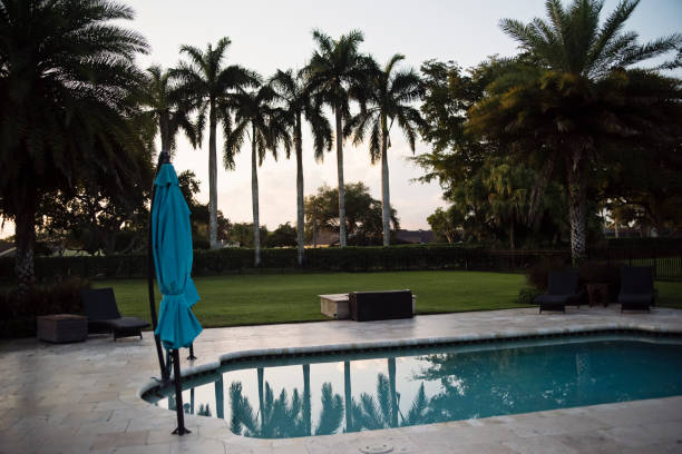 edge of a swimming pool with clean water, aerial photography from a drone evoking relaxation. Vacation rental concept