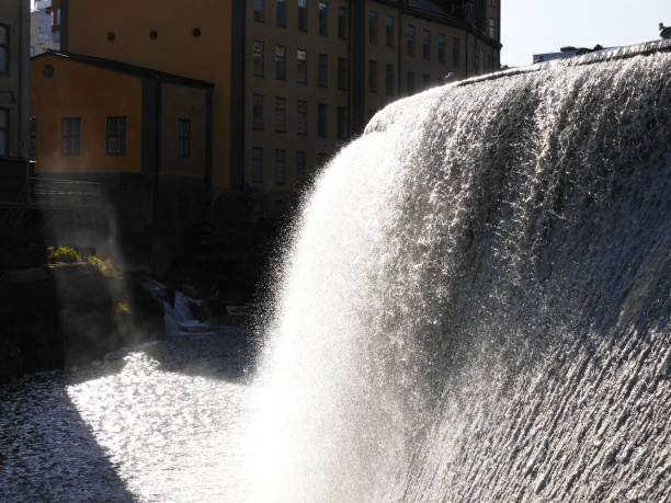 istock Old industrial building next to a canal 1560784143