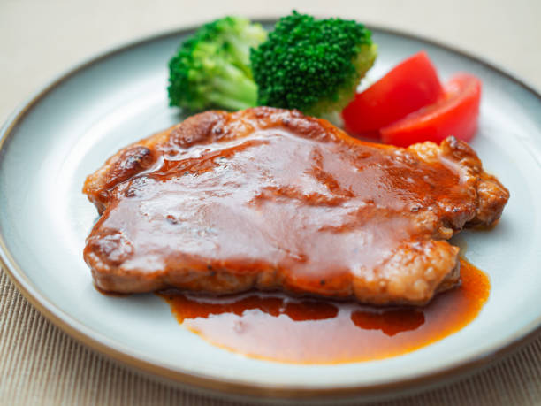 istock Pork steak with tomato sauce 1560817930