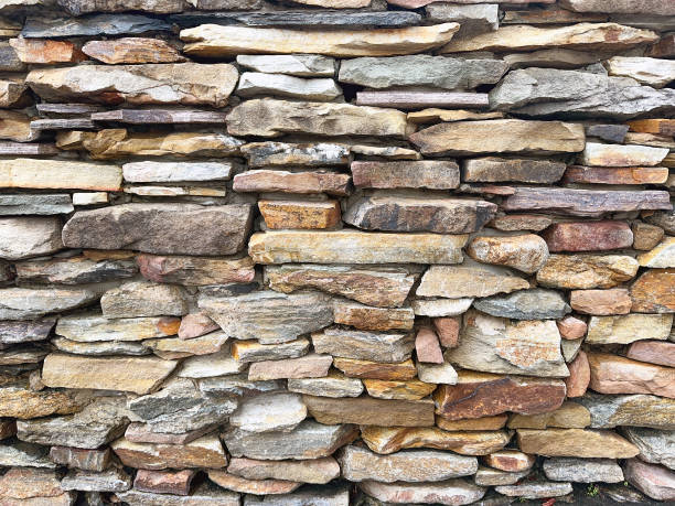 istock Stones arranged in a dry stone wall 1560826492