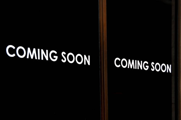 istock Coming soon sign in an empty shop 1560826510