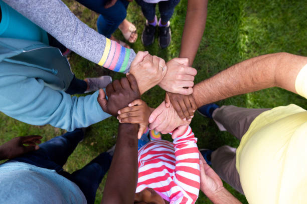 Multi Generational Family Standing together and holding each others arms