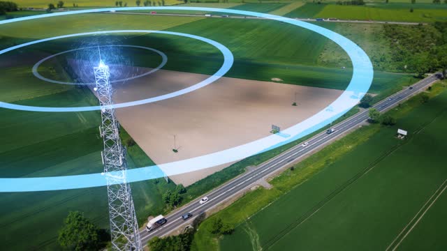 Animated visualization of radio waves emitted by a cell tower. Antenna near the road with passing cars retransmits digital signal transmission. Concept of wireless communication, data broadcast, 5G.