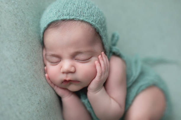 istock Newborn baby girl sleeping 1560875069
