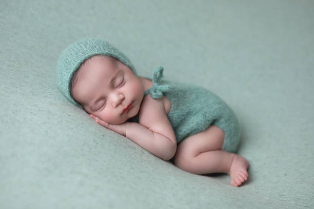 istock Newborn baby girl sleeping 1560875072