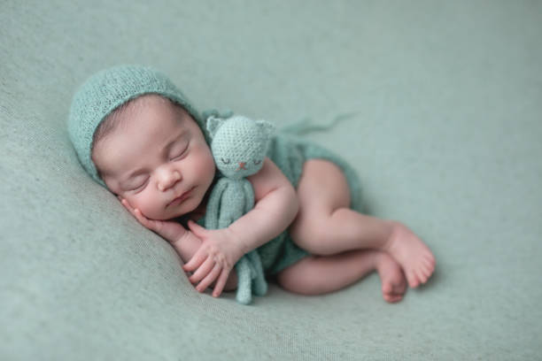 istock Newborn baby girl sleeping 1560875073