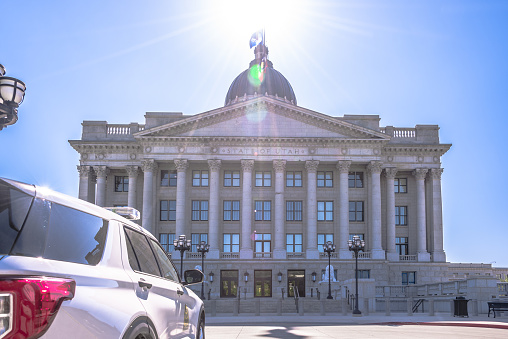 Salt Lake City, USA - June 16, 2023: A Utah State Police patrol vehicle parked in front of the Utah State Capitol.