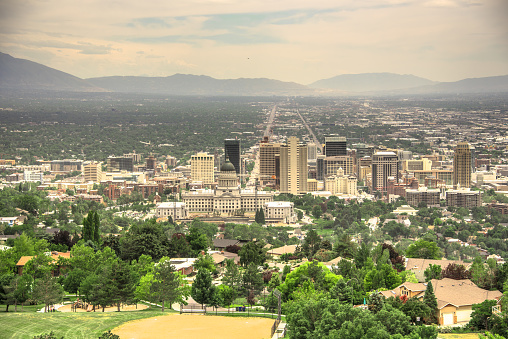 Salt Lake City, USA - June 16, 2023: Salt Lake Valley is surrounded by mountain ranges and Great Salt Lake. Utah State Capitol and Salt Lake City downtown can be seen from view point.