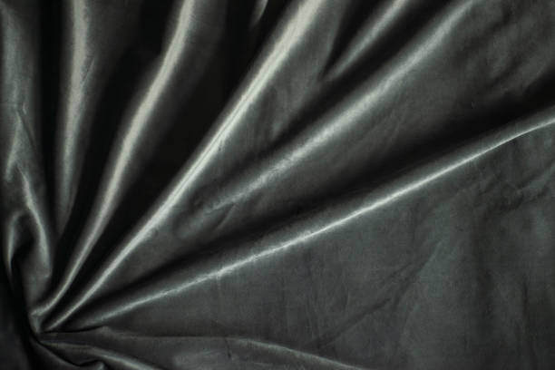 istock black velvet with pleated stripes, luxury silk fabric background 1560910780