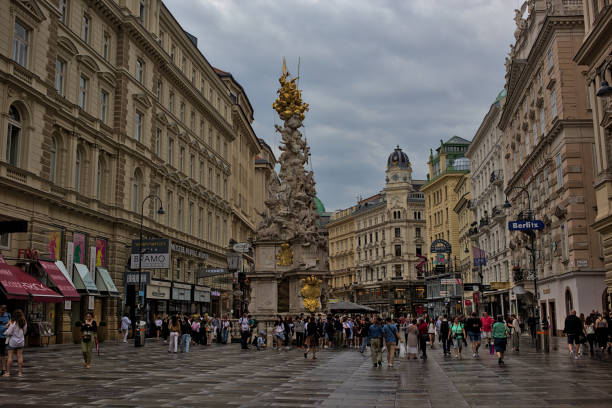 Vienna, Austria - June 27, 2023: Plague Column, Trinity Column, on Graben street in Inner City district. A very popular place among tourists. Streets and architecture of the old city.