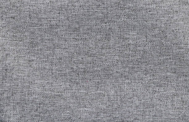 istock Grey color denim jeans fabric texture. Horizontal or vertical light gray denim background 1560971832