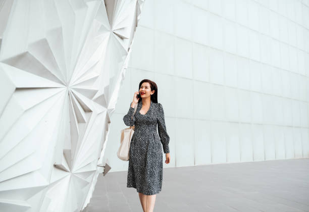 istock Freelance Accountant talking on the phone while walking to work 1560995472