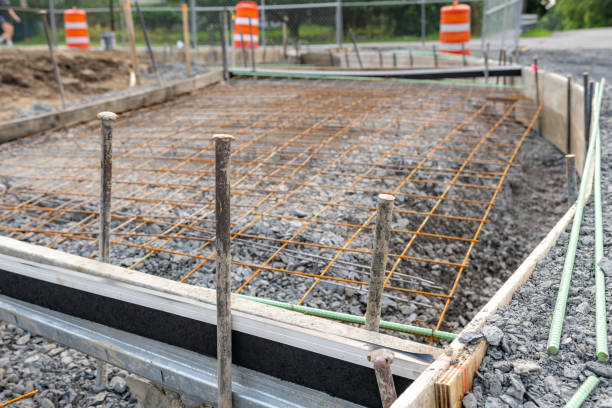 istock Welded wire mesh, WWM, installed within a sidewalk concrete form prior to the installation of concrete. 1561038691