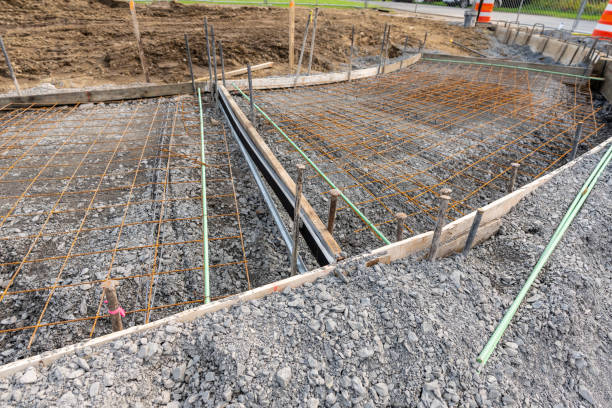 istock Welded wire mesh, WWM, installed within a sidewalk concrete form prior to the installation of concrete. 1561040321