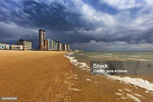 Vlissingen A Beautiful Sandy Bay At Low Tide With A Coastal Promenade Of Houses Hotels And Restaurants Dramatic Sky Full Of Clouds Stock Photo - Download Image Now
