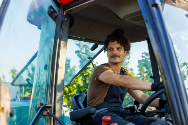 istock A Farmer Drives A Tractor On A Farm 1561071741