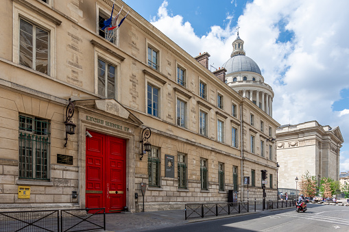 Paris, France - July 21, 2023: Facade of Lycée Henri IV, a public secondary and higher education institution located in the Latin Quarter, with the Pantheon dome in the background